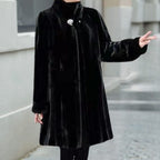 Women's black A-line faux-fur stand-collar coat, angled view