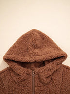 Front close-up of attached hood on women's brown teddy jacket