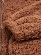Close-up of sleeve cuff on women's brown teddy jacket