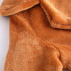 Close-up of wide lapel on women's brown plush coat