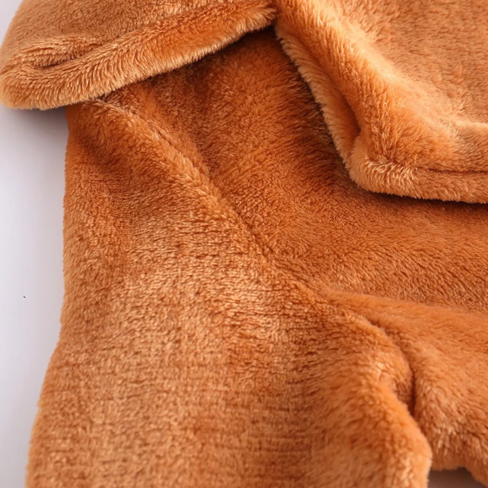 Close-up of wide lapel on women's brown plush coat