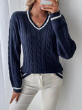 Women's navy V-neck cable knit sweater front view