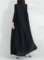 Women's black long-sleeve wrap maxi coat dress, back view